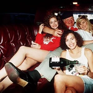 Comedian Benny Hill in a car with some of his Hills Angels