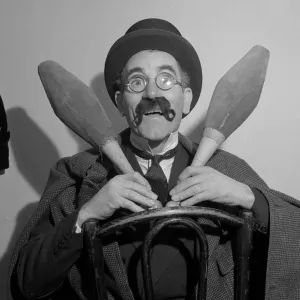 Comedian Eddie Gray seen here holding skittles wearing a false moustache Comic Comedian Eddie Gray seen here holding skittles wearing a false moustache Comic