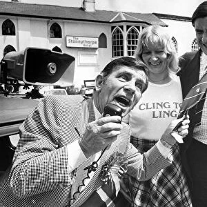 Comedian Norman Wisdom repays a favour by canvassing for Midlands Central Tory candidate