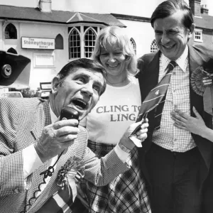 Comedian Norman Wisdom repays a favour by canvassing for Midlands Central Tory candidate Comedian Norman Wisdom repays a favour by canvassing for Midlands Central Tory candidate