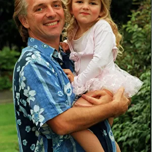 Comedian Rik Mayall with his youngest daughter Bonnie. 12th September 1998