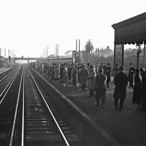 Commuters await the next train to Waterloo. November 1938 Commuters await the next train to Waterloo. November 1938