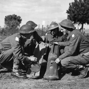 Company Sergeant Major Plunkett explains the working of the butterfly bombs Company Sergeant Major Plunkett explains the working of the butterfly bombs