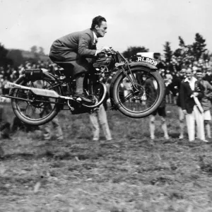 A competitor doing a long jump on his motor-cycle during the sports held in connection A competitor doing a long jump on his motor-cycle during the sports held in connection