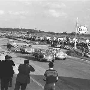 Competitors take the checkered flag in the Molyslip Morris 1100 race at Snetterton race Competitors take the checkered flag in the Molyslip Morris 1100 race at Snetterton race