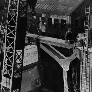 Construction of the new Tyne Bridge. A large crowd were keenly interested in the lifting Construction of the new Tyne Bridge. A large crowd were keenly interested in the lifting