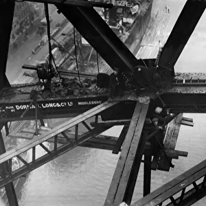 Construction of the new Tyne Bridge. Riveters at work on the lower boom