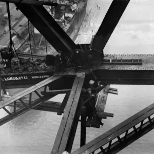Construction of the new Tyne Bridge. Riveters at work on the lower boom Construction of the new Tyne Bridge. Riveters at work on the lower boom