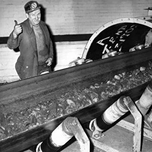 Conveyor belt operator Fred Bolton watches as the 1, 000
