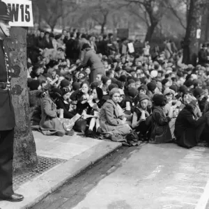 Coronation of King George VI. Policeman on guard as huge crowds gather to watch