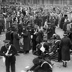 Coronation of King George VI. St Johns Ambulance workers treating injured people in