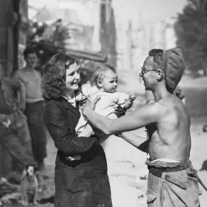 Corporal Arthur Toman greeting locals in Caen during the Second World War Corporal Arthur Toman greeting locals in Caen during the Second World War