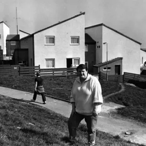Print of Denise Yeates outside refurbished houses on the Penrhys Estate Print of Denise Yeates outside refurbished houses on the Penrhys Estate