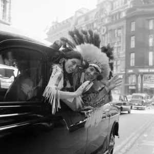 Couple of actors dressed as an Indian Chief and his Squaw