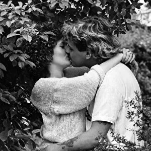 Couple kissing amongst the trees. July 1987 P010012