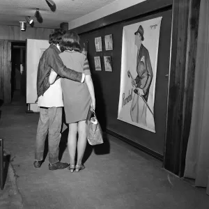 A couple looking at art. Birmingham Art Centre, Birmingham, West Midlands