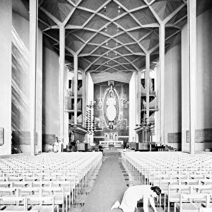 Craftsmen put the finishing touches to the new Coventry Cathedral which stands alongside