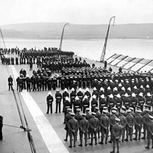 The crew of the British Royal Navy Aircraft Carrier HMS Courageous parade on the flight