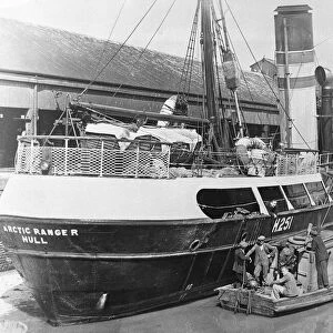The crew of a diving boat chat with a crew member of the Boyd Line Ltd sidewinder trawler