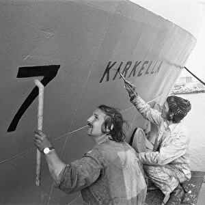 The crew of the Hull based stern trawler Kirkella seen here repainting the ships name