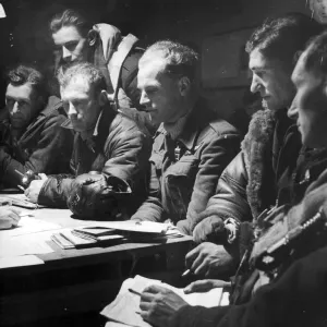 The crew of an RAF Stirling bomber interrorgated after their return from a big raid