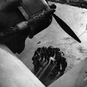 The crew of a Stirling bomber consulting a map. February 1942 The crew of a Stirling bomber consulting a map. February 1942