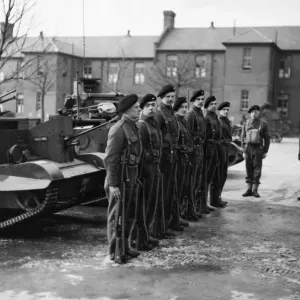 Crews of the Bren Gun Carriers do a little musketry drill during their training somewhere