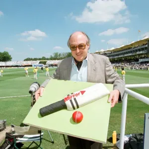 Cricket commentator Henry Blofeld is presented with a Daily Mirror cake in the shape of a