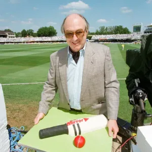 Cricket commentator Henry Blofeld is presented with a Daily Mirror cake in the shape of a