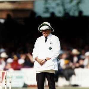 Cricket test umpire Dickie Bird weaing two hats, May 1993