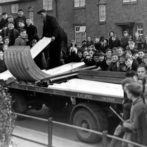 A crowd of excited youngsters watched the delivery of the first consignment of ARP air A crowd of excited youngsters watched the delivery of the first consignment of ARP air
