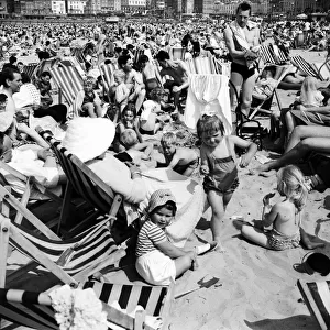 Crowds on the beach at Margate in Kent during a hot summer day. June 1960 M4328-007