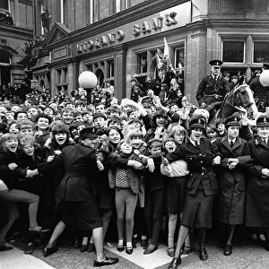 Crowds of Beatles fans outside the ABC theatre as the Beatles arrive for the Northern