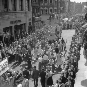 Crowds dancing in the street during the Soho Fair in Central London. 10th July 1955 Crowds dancing in the street during the Soho Fair in Central London. 10th July 1955