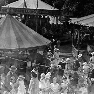 Crowds enjoying the Tolworth Fun Fair in 1934