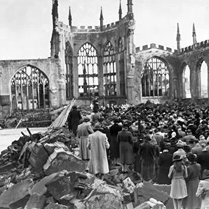 Crowds gather for a remembrance service inside the ruins of Coventry Cathedral after it