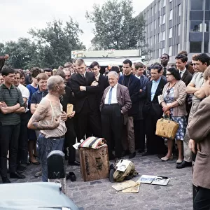 Crowds gather round to hear one of the Tower Hill characters speaking at lunch time, 1966