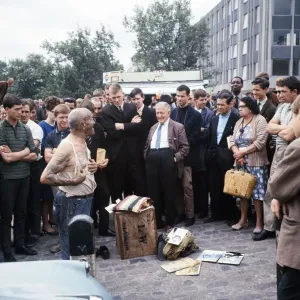 Crowds gather round to hear one of the Tower Hill characters speaking at lunch time, 1966