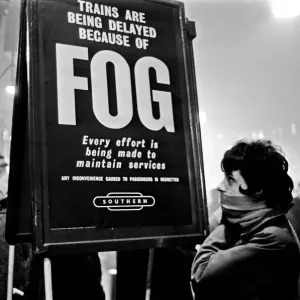 Crowds of people waiting at Waterloo station as trains are delayed due to fog
