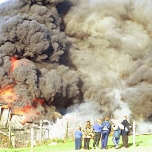 Crowds watch the smoke billow from a fire at Swalwell