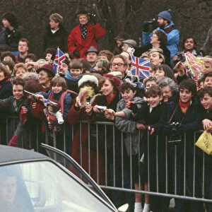 Crowds of well-wishers wait patiently for the arrival of Princess Diana