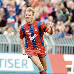 Crystal Palace footballer Geoff Thomas celebrates after scoring a goal in the league