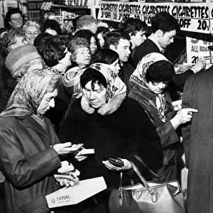 Customers crowding round a cigarette counter in the Co-op in London Road, Liverpool