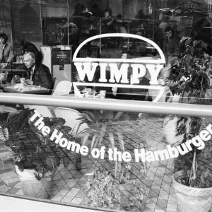 Customers enjoying a lunchtime burger at at Wimpy restaurant in London Customers enjoying a lunchtime burger at at Wimpy restaurant in London