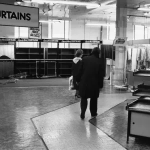 Some of the last customers wander through the empty sales floor as Blackers Department Some of the last customers wander through the empty sales floor as Blackers Department