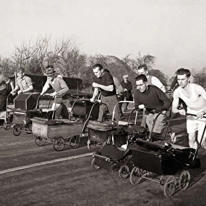 Dads take part in a Pram Race in Bognor Sussex on Boxing Day Pram - Men