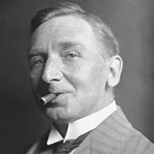 Daily Mirrors first ever photograper Ivor Castle, poses for a portrait smoking a
