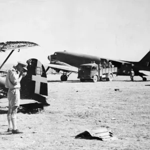 Dakota transport planes being unloaded on a captured airfield in southern Italy during