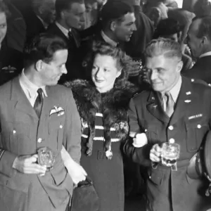 Print of Wing Commander Guy Gibson with Mrs. Gibson and Captain W.K Clark, U.S Army, June 22nd 1943