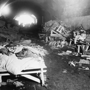 Damaged beds inside a bomb shelter during the Second World War. 17th February 1941